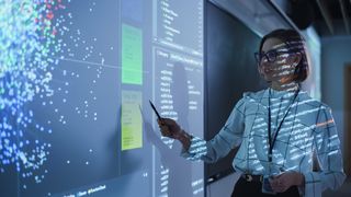 Young Female Teacher Giving a Data Science Presentation